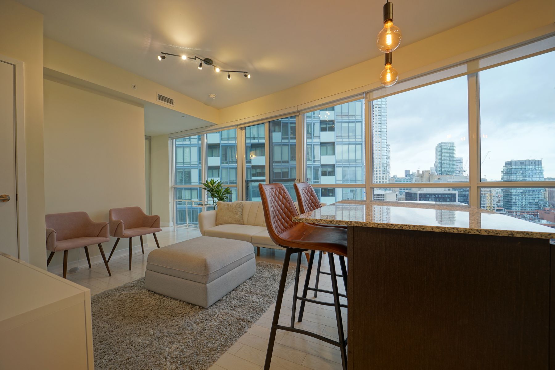 Sunlit condominium living room photographed by Abhishek