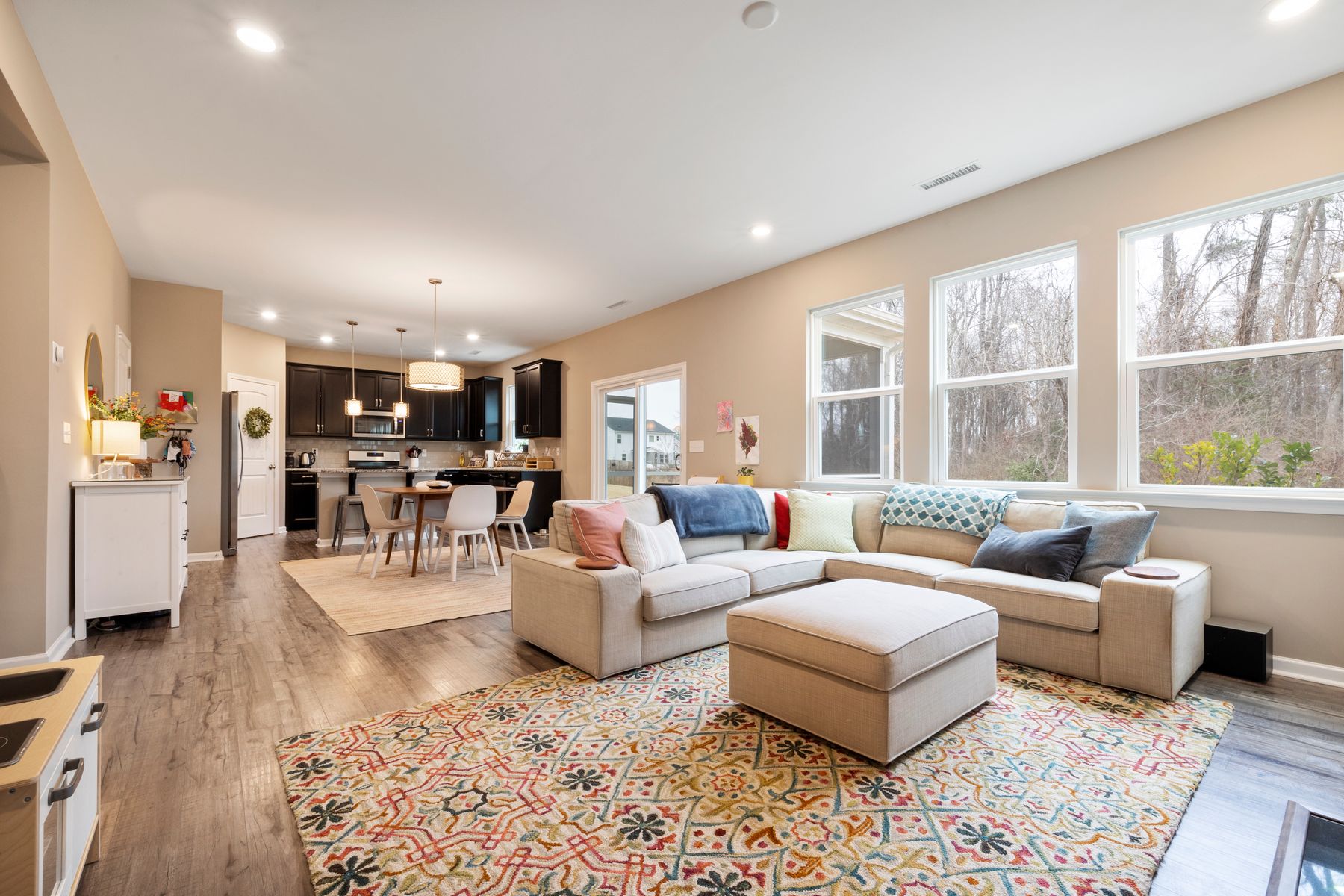 Inviting open-plan living room with soft seating and daylight